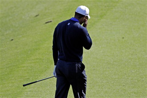 
 Tiger Woods reacts after his tee shot on the 12th hole during the second round of the Masters golf tournament Friday, April 6, 2012, in Augusta, Ga. (AP Photo/Matt Slocum)
 